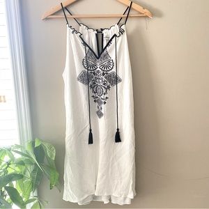 SPEECHLESS | white dress with black design and tassels